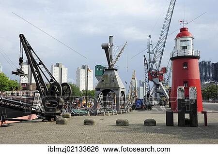 Red lighthouse and cranes in Leuvehaven harbour, part of the Maritime Museum, Central Rotterdam, Holland, Nederland, the Netherlands, Europe View Large Photo Image Stock Photograph - Red lighthouse and cranes in Leuvehaven harbour, part of the Maritime Museum, Central Rotterdam, Holland, Nederland, the Netherlands, Europe. Fotosearch