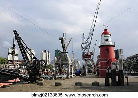 Red lighthouse and cranes in Leuvehaven harbour, part of the Maritime Museum, Central Rotterdam, Holland, Nederland, the Netherlands, Europe View Large Photo Image Stock Photography - Red lighthouse and cranes in Leuvehaven harbour, part of the Maritime Museum, Central Rotterdam, Holland, Nederland, the Netherlands, Europe. Fotosearch