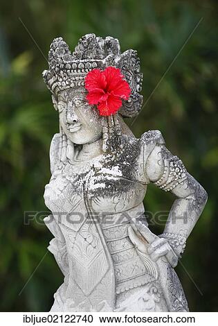 Stock Image - Religious stone sculpture with floral decoration, Nusa Dua, Bali, Indonesia, Southeast Asia, Asia. Fotosearch