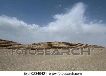 Remnant of the original first part of the Great Wall of China in the middle of the dry desert landscape, historic Silk Road, Yumen Pass, Yadan National Park, Gansu, China, Asia View Large Photo Image Stock Image - Remnant of the original first part of the Great Wall of China in the middle of the dry desert landscape, historic Silk Road, Yumen Pass, Yadan National Park, Gansu, China, Asia. Fotosearch