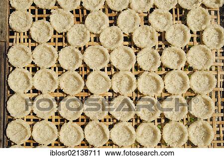 Rice cakes drying in the sun, Luang Prabang, Laos, Indochina, Asia View Large Photo Image Stock Image - Rice cakes drying in the sun, Luang Prabang, Laos, Indochina, Asia. Fotosearch