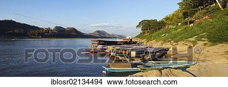 Picture - River boats on the Mekong River, Luang Prabang, Laos, Indochina, Asia. Fotosearch