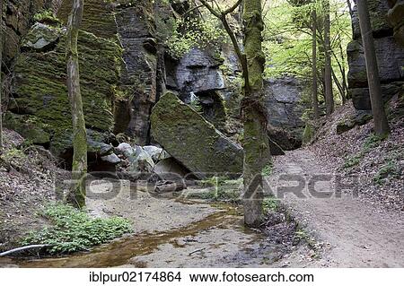 Picture - Rock arch in Uttewalder Grund, hiking trail near Wehlen, Saxon Switzerland, Saxony, Germany, Europe. Fotosearch