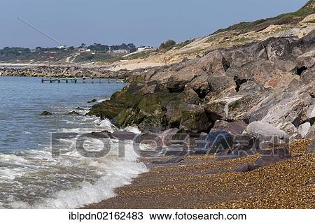 Rock stone groynes sea defences at Barton on Sea, Hampshire, England, United Kingdom, Europe View Large Photo Image Stock Image - Rock stone groynes sea defences at Barton on Sea, Hampshire, England, United Kingdom, Europe. Fotosearch