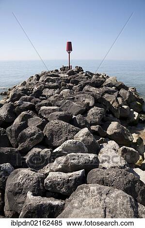 Rock stone groynes sea defences at Barton on Sea, Hampshire, England, United Kingdom, Europe View Large Photo Image Stock Photography - Rock stone groynes sea defences at Barton on Sea, Hampshire, England, United Kingdom, Europe. Fotosearch