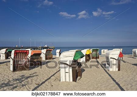 Roofed wicker beach chairs standing on the beach, Dahme, Baltic Sea, Schleswig-Holstein, Germany, Europe View Large Photo Image Stock Photo - Roofed wicker beach chairs standing on the beach, Dahme, Baltic Sea, Schleswig-Holstein, Germany, Europe. Fotosearch