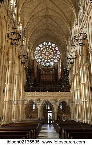 Stock Photography - Rose window and aisle, interior of the cathedral Church of Our Lady and St Philip Howard, Arundel, West Sussex, England, United Kingdom, Europe. Fotosearch