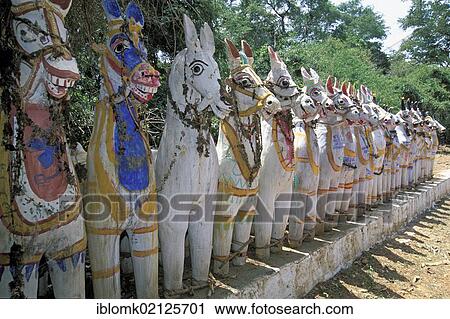 Stock Image - Row of painted clay horses, at Karaikudi, Tamil Nadu, South India, India, Asia. Fotosearch