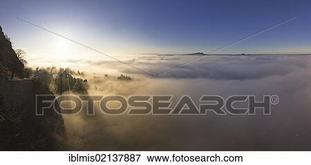 Stock Photo - Ruins of Hohentwiel Fortress in a foggy atmosphere, Hegau, Konstanz district, Baden-Wuerttemberg, Germany, Europe. Fotosearch