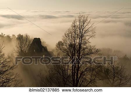Stock Photography - Ruins of Hohentwiel Fortress in a foggy atmosphere, Hegau, Konstanz district, Baden-Wuerttemberg, Germany, Europe. Fotosearch