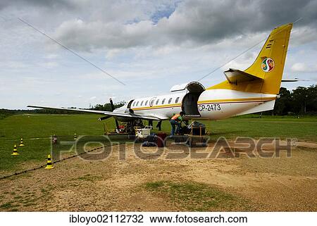 Stock Image - Rurrenabaque Airport, with a stretch of grass as a runway, gateway to Madidi National Park, Bolivia, South America. Fotosearch