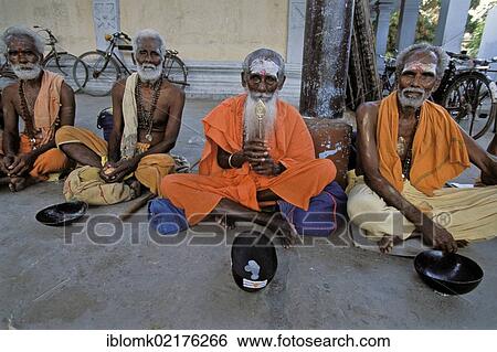Stock Photograph - Sadhus with begging bowls, entrance to Tiruchendur Sea-Temple for Lord Subrahmanyam, Tiruchendur, Tamil Nadu, South India, India, Asia. Fotosearch