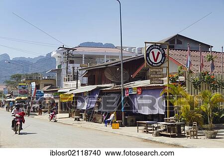 Stock Image - Shops and restaurants along the main road, Vang Vieng, Vientiane, Laos, Indochina, Asia. Fotosearch