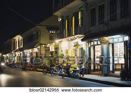 Shops and restaurants on the main street, Sisavangvong Road, at night, Luang Prabang, Laos, Indochina, Asia View Large Photo Image Stock Photography - Shops and restaurants on the main street, Sisavangvong Road, at night, Luang Prabang, Laos, Indochina, Asia. Fotosearch