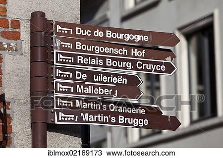 Sign indicating the route to various hotels, old town of Bruges, UNESCO World Heritage Site, West Flanders, Flemish Region, Belgium, Europe View Large Photo Image Stock Image - Sign indicating the route to various hotels, old town of Bruges, UNESCO World Heritage Site, West Flanders, Flemish Region, Belgium, Europe. Fotosearch