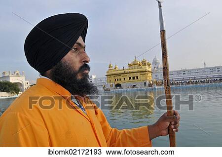 Stock Image - Sikh guard, Golden Temple, Amritsar, Punjab, North India, India, Asia. Fotosearch