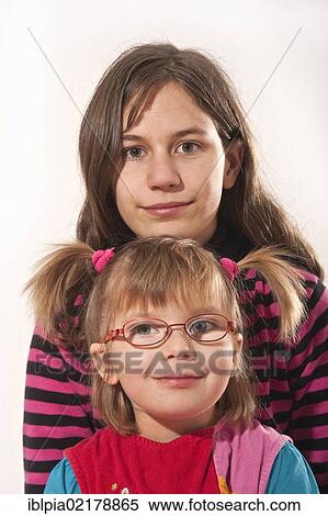 Sisters, 5 and 13 year old girls View Large Photo Image Stock Photography - Sisters, 5 and 13 year old girls. Fotosearch