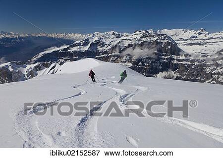 Skiing tour with mountain panoramic views, ski run through powder snow from Mt Torrenthorn, Leukerbad, Valais, Switzerland, Europe View Large Photo Image Stock Photo - Skiing tour with mountain panoramic views, ski run through powder snow from Mt Torrenthorn, Leukerbad, Valais, Switzerland, Europe. Fotosearch