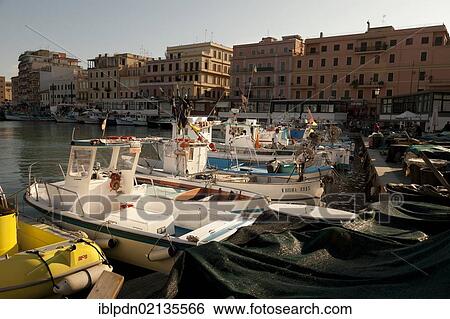 Small fishing boats moored stern first in Anzio harbour, Lazio, Italy, Europe View Large Photo Image Stock Photograph - Small fishing boats moored stern first in Anzio harbour, Lazio, Italy, Europe. Fotosearch
