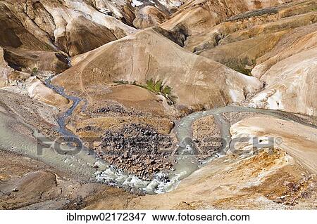 Small river flowing through the colourful hills and rhyolite mountains of the geothermal area of Kerlingarfjoell Glacier in the interior highlands of Iceland, Europe View Large Photo Image Stock Photo - Small river flowing through the colourful hills and rhyolite mountains of the geothermal area of Kerlingarfjoell Glacier in the interior highlands of Iceland, Europe. Fotosearch