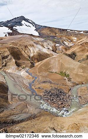 Small river flowing through the colourful hills and rhyolite mountains of the geothermal area of Kerlingarfjoell Glacier in the interior highlands of Iceland, Europe View Large Photo Image Stock Photograph - Small river flowing through the colourful hills and rhyolite mountains of the geothermal area of Kerlingarfjoell Glacier in the interior highlands of Iceland, Europe. Fotosearch