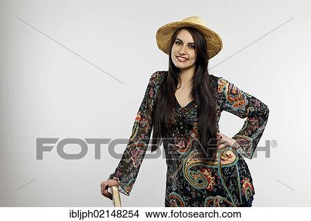 Picture - Smiling young woman wearing a hat. Fotosearch