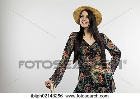 Stock Photograph - Smiling young woman wearing a hat. Fotosearch