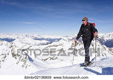 Snowshoe hiker on Hoertlahner Mountain above Durnholz, Sarn Valley, Alto Adige, Italy, Europe View Large Photo Image Stock Photo - Snowshoe hiker on Hoertlahner Mountain above Durnholz, Sarn Valley, Alto Adige, Italy, Europe. Fotosearch