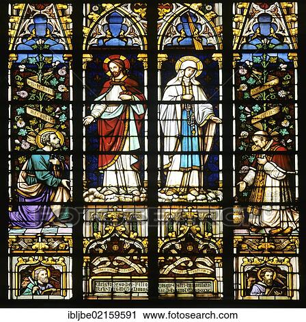 Stock Image - Stained glass church window, icon, Normandy, France, Europe. Fotosearch