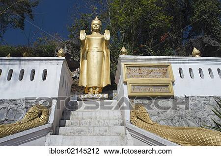 Standing Buddha statue at a temple on Phousi Mountain, Luang Prabang, Laos, Indochina, Asia View Large Photo Image Stock Image - Standing Buddha statue at a temple on Phousi Mountain, Luang Prabang, Laos, Indochina, Asia. Fotosearch