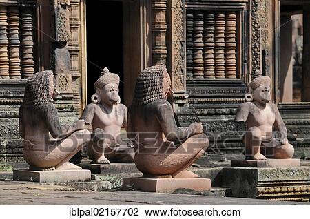 Stock Image - Stone guardian statues, temple, Banteay Srei, Angkor, Siem Reap, Cambodia, Southeast Asia, Asia. Fotosearch
