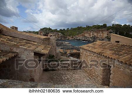 Stone houses, Cala s'Almunia, southeast coast, Majorca, Balearic Islands, Spain, Europe View Large Photo Image Stock Photography - Stone houses, Cala s'Almunia, southeast coast, Majorca, Balearic Islands, Spain, Europe. Fotosearch