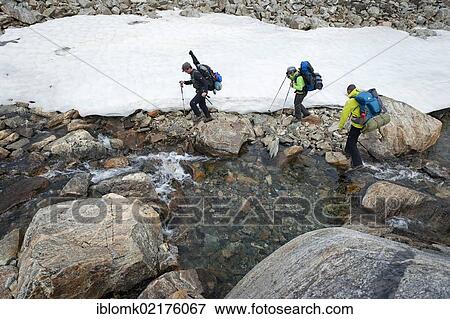 Stream and a field of snow, hikers at Mittivakkat Glacier, Ammassalik Peninsula, East Greenland, Greenland, North America View Large Photo Image Stock Photo - Stream and a field of snow, hikers at Mittivakkat Glacier, Ammassalik Peninsula, East Greenland, Greenland, North America. Fotosearch