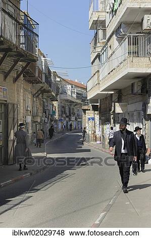 Street scene with Orthodox Jews and typical houses in the district of Me'a She'arim or Mea Shearim, Jerusalem, Israel, Middle East, Asia View Large Photo Image Stock Photo - Street scene with Orthodox Jews and typical houses in the district of Me'a She'arim or Mea Shearim, Jerusalem, Israel, Middle East, Asia. Fotosearch