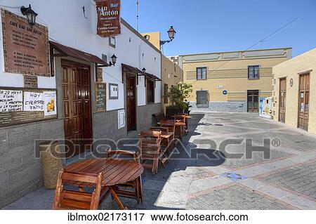 Street with small restaurants in the historic centre of Agueimes, Gran Canaria, Canary Islands, Spain, Europe View Large Photo Image Stock Photo - Street with small restaurants in the historic centre of Agueimes, Gran Canaria, Canary Islands, Spain, Europe. Fotosearch