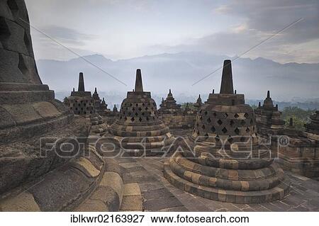Stupas at dawn, Borobudur Buddhist Temple, Borobudur, Java, Indonesia, Southeast Asia, Asia View Large Photo Image Stock Photo - Stupas at dawn, Borobudur Buddhist Temple, Borobudur, Java, Indonesia, Southeast Asia, Asia. Fotosearch