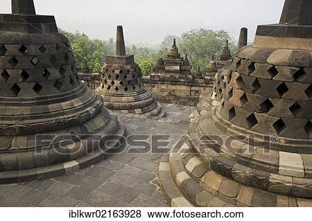 Stupas, Borobudur Buddhist Temple, Borobudur, Java, Indonesia, Southeast Asia, Asia View Large Photo Image Stock Photo - Stupas, Borobudur Buddhist Temple, Borobudur, Java, Indonesia, Southeast Asia, Asia. Fotosearch