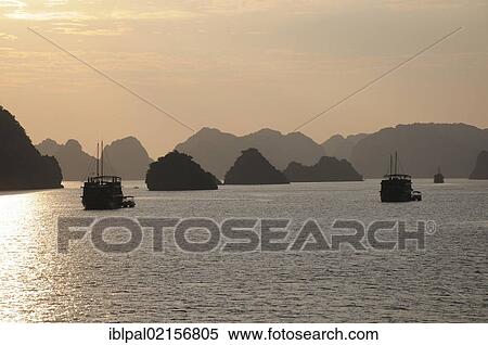 Stock Photography - Sunrise, Halong Bay, Vietnam, Southeast Asia, Asia. Fotosearch