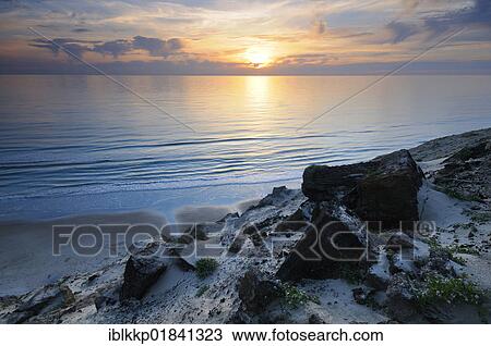 Sunset and coastal cliff at Rubjerg Knude, a wandering dune in Denmark, Europe View Large Photo Image Stock Image - Sunset and coastal cliff at Rubjerg Knude, a wandering dune in Denmark, Europe. Fotosearch