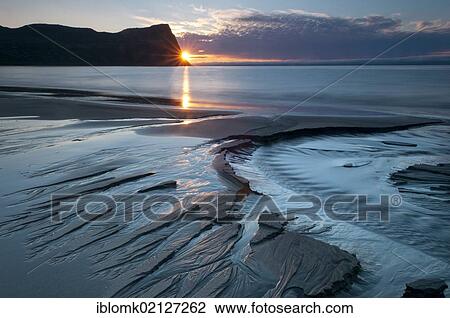 Stock Image - Sunset, mouth of the Horná creek in Hloeðuvík, Hloeduvik, Hornstrandir, Westfjords, Iceland, Europe. Fotosearch