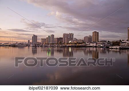 Sunset over the skyline in Manila bay, Manila, Philippines, Asia View Large Photo Image Stock Photo - Sunset over the skyline in Manila bay, Manila, Philippines, Asia. Fotosearch