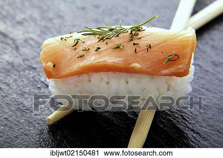 Sushi, nigiri with salmon and chopsticks on a slate surface View Large Photo Image Stock Image - Sushi, nigiri with salmon and chopsticks on a slate surface. Fotosearch