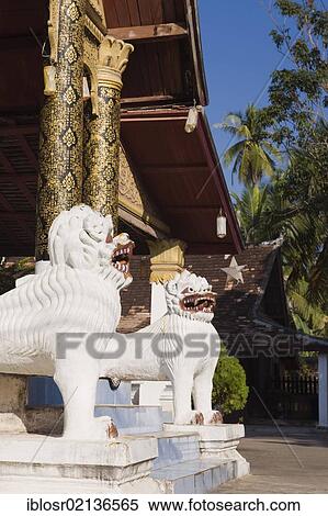 Temple guardians outside Wat Sirimoungkhounsayaram Temple, Luang Prabang, UNESCO World Heritage Site, Laos, Indochina, Asia View Large Photo Image Stock Photography - Temple guardians outside Wat Sirimoungkhounsayaram Temple, Luang Prabang, UNESCO World Heritage Site, Laos, Indochina, Asia. Fotosearch