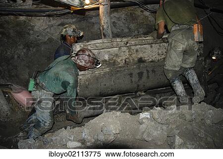 Stock Photography - The Mineros del Diablo or "Devil's Miners", inside the Cerro Rico, "The mountain that eats men alive", Potosi, Bolivia, South America. Fotosearch
