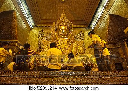 The most holy Buddha of the country, the golden Mahamuni Buddha is covered in gold leaf by believers, Mandalay, Burma, Myanmar, Southeast Asia, Asia View Large Photo Image Picture - The most holy Buddha of the country, the golden Mahamuni Buddha is covered in gold leaf by believers, Mandalay, Burma, Myanmar, Southeast Asia, Asia. Fotosearch