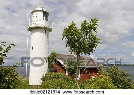 The old lighthouse at Backviken harbour on the island of Hven or Ven in Oresund, Sweden, Europe View Large Photo Image Picture - The old lighthouse at Backviken harbour on the island of Hven or Ven in Oresund, Sweden, Europe. Fotosearch