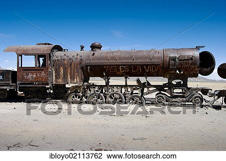 Stock Image - The train cemetery, Salar de Uyuni or salt desert of Uyuni, Bolivia, South America. Fotosearch
