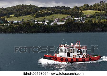 The tug Algarrobo im the harbour area of Quellon, Chiloe Island, Region de los Lagos, Chile, South America, America, South America View Large Photo Image Picture - The tug Algarrobo im the harbour area of Quellon, Chiloe Island, Region de los Lagos, Chile, South America, America, South America. Fotosearch