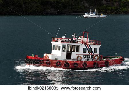 The tug Algarrobo in the harbour area of Quellon, Chiloe Island, Region de los Lagos, Chile, South America, America, South America View Large Photo Image Stock Photography - The tug Algarrobo in the harbour area of Quellon, Chiloe Island, Region de los Lagos, Chile, South America, America, South America. Fotosearch