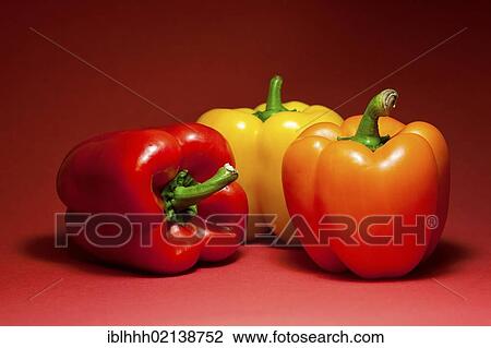 Stock Image - Three bell peppers (Capsicum). Fotosearch